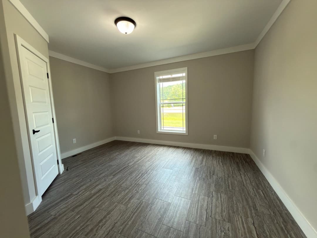 The barndominium bedroom home features