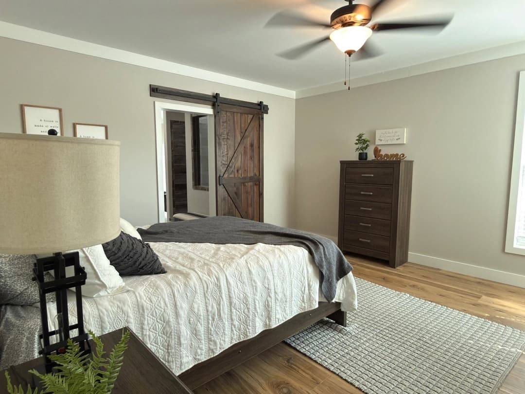 The barndominium bedroom home features